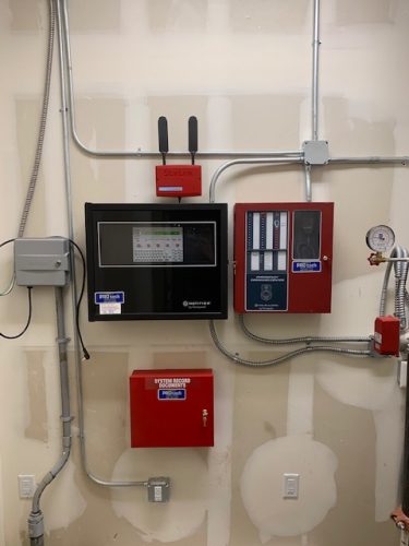 Wall with installed fire alarm by PROtech Security and Electronics Modesto and Merced CA